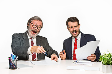 Image showing The two colleagues working together at office on white background.