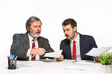 Image showing The two colleagues working together at office on white background.