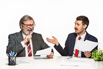 Image showing The two colleagues working together at office on white background.