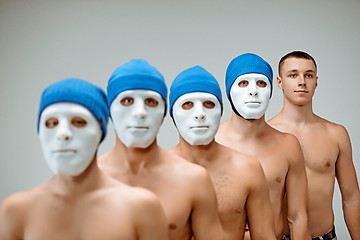 Image showing The people in masks and one man without mask