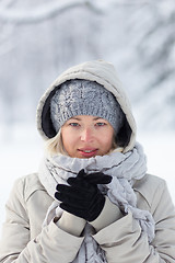 Image showing Portrait of lady outdoor in snow in cold winter time.