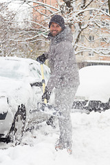 Image showing Man shoveling snow in winter.