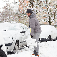 Image showing Man shoveling snow in winter.