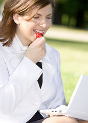 Image showing business lady with strawberry