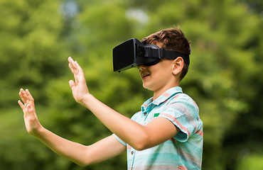 Image showing boy with virtual reality headset outdoors