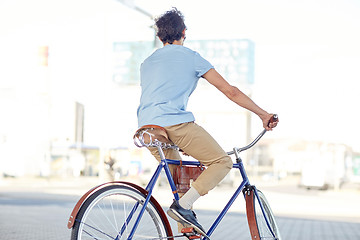 Image showing hipster man riding fixed gear bike
