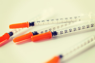 Image showing close up of insulin syringes on table