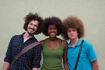 Image showing multiethnic group of happy three friends