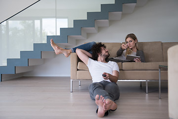 Image showing young couple relaxes in the living room