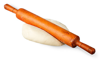 Image showing Rolling pin on a piece of dough