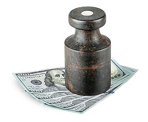 Image showing Banknotes clamped old rusty weights