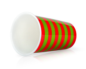 Image showing Red and green cup without handle lying down