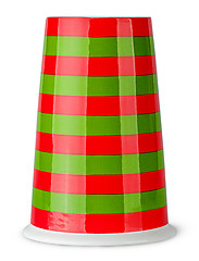 Image showing Red and green striped cup without handle inverted