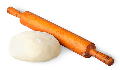 Image showing Piece of dough beside rolling pin