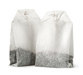 Image showing Two tea bags with thread vertically