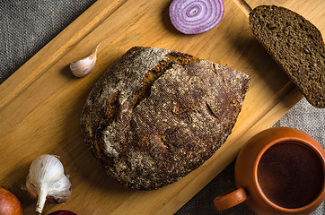 Image showing Top view on homemade bread and onions