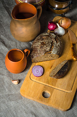 Image showing Top view on homemade bread and pottery