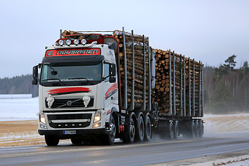 Image showing Volvo FH Logging Truck Hauls Wood in Winter