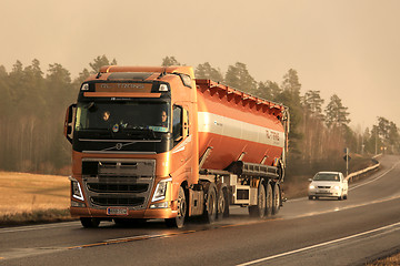 Image showing Volvo FH Semi Bulk Transport Truck in Winter Afternoon Snowstorm