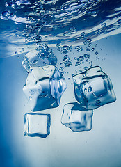 Image showing Ice cubes falling under water