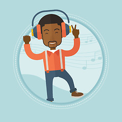 Image showing Man listening to music in headphones and dancing.
