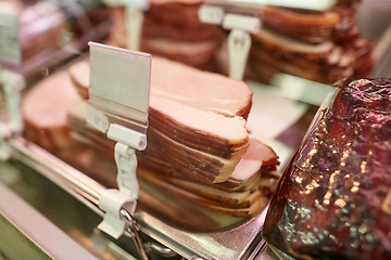 Image showing ham at grocery store stall