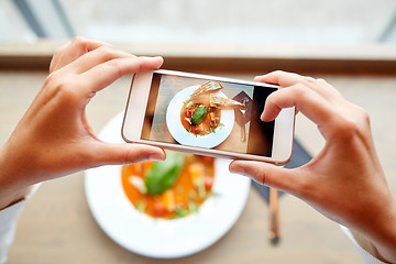 Image showing hands with smartphone photographing food