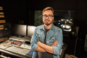 Image showing man at mixing console in music recording studio