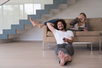 Image showing young couple relaxes in the living room