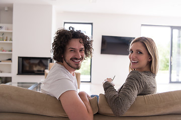 Image showing Rear view of couple watching television