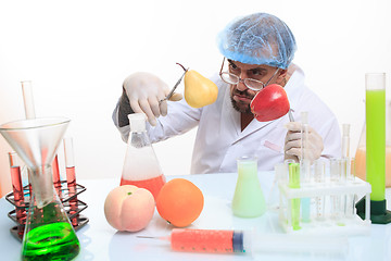 Image showing scientist fills chemicals fruit and vegetables