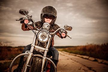 Image showing Biker girl on a motorcycle