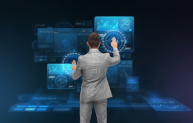 Image showing businessman working with virtual screens