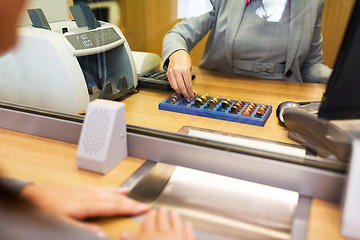 Image showing clerk counting cash money at bank office