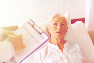 Image showing doctor visiting senior woman patient at hospital