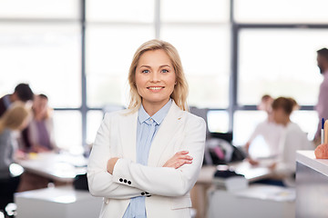 Image showing smiling businesswoman at office