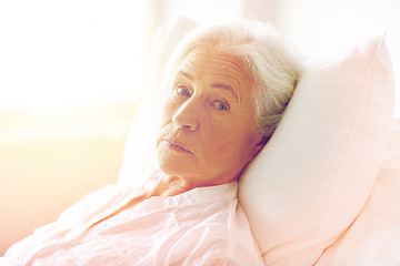 Image showing senior woman patient lying in bed at hospital ward