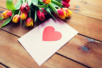 Image showing close up of flowers and greeting card with heart