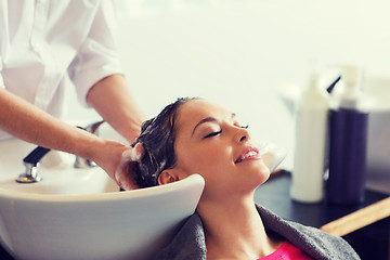 Image showing happy young woman at hair salon