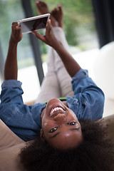 Image showing african american woman at home with digital tablet