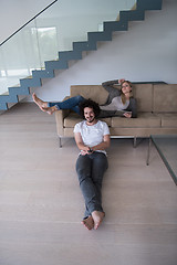 Image showing young couple relaxes in the living room