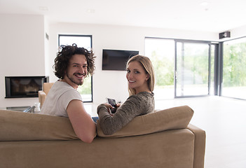 Image showing Rear view of couple watching television