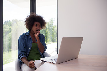 Image showing African American woman in the living room