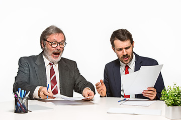 Image showing The two colleagues working together at office on white background.