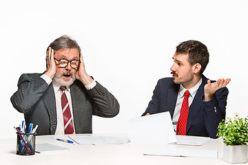 Image showing The two colleagues working together at office on white background.