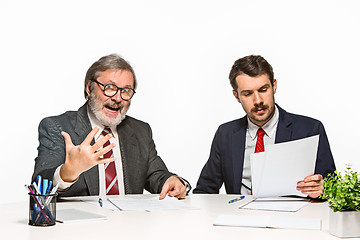 Image showing The two colleagues working together at office on white background.