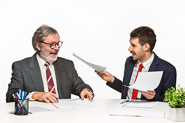 Image showing The two colleagues working together at office on white background.