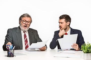 Image showing The two colleagues working together at office on white background.