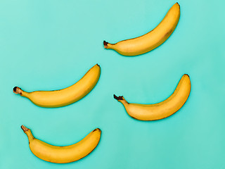 Image showing The group of bananas against blue background