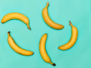 Image showing The group of bananas against blue background